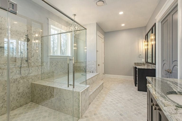 Luxury frameless glass shower enclosure with sleek hardware and seamless design
